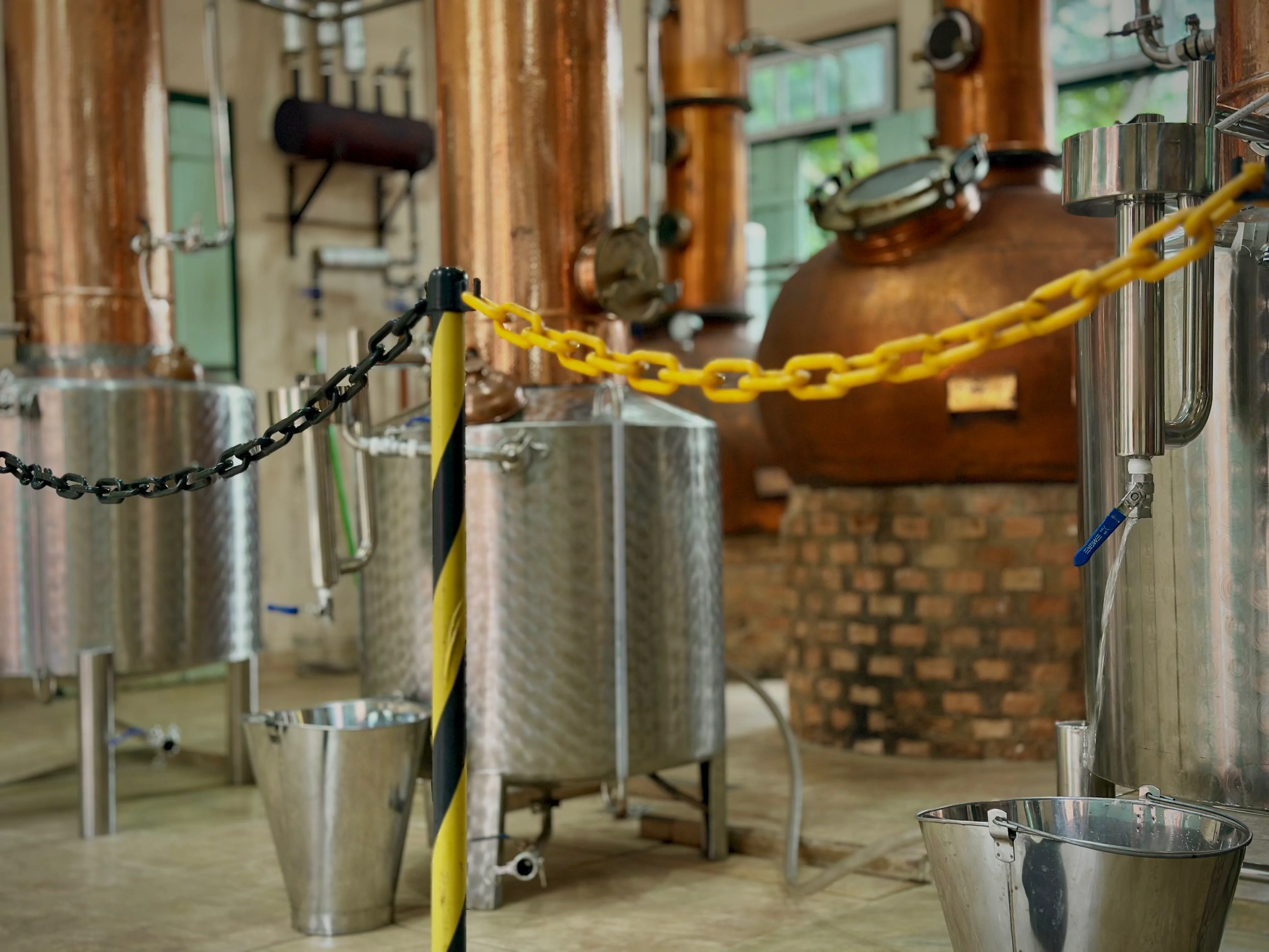 Traditional copper stills and artisanal cachaça production in Paraty.